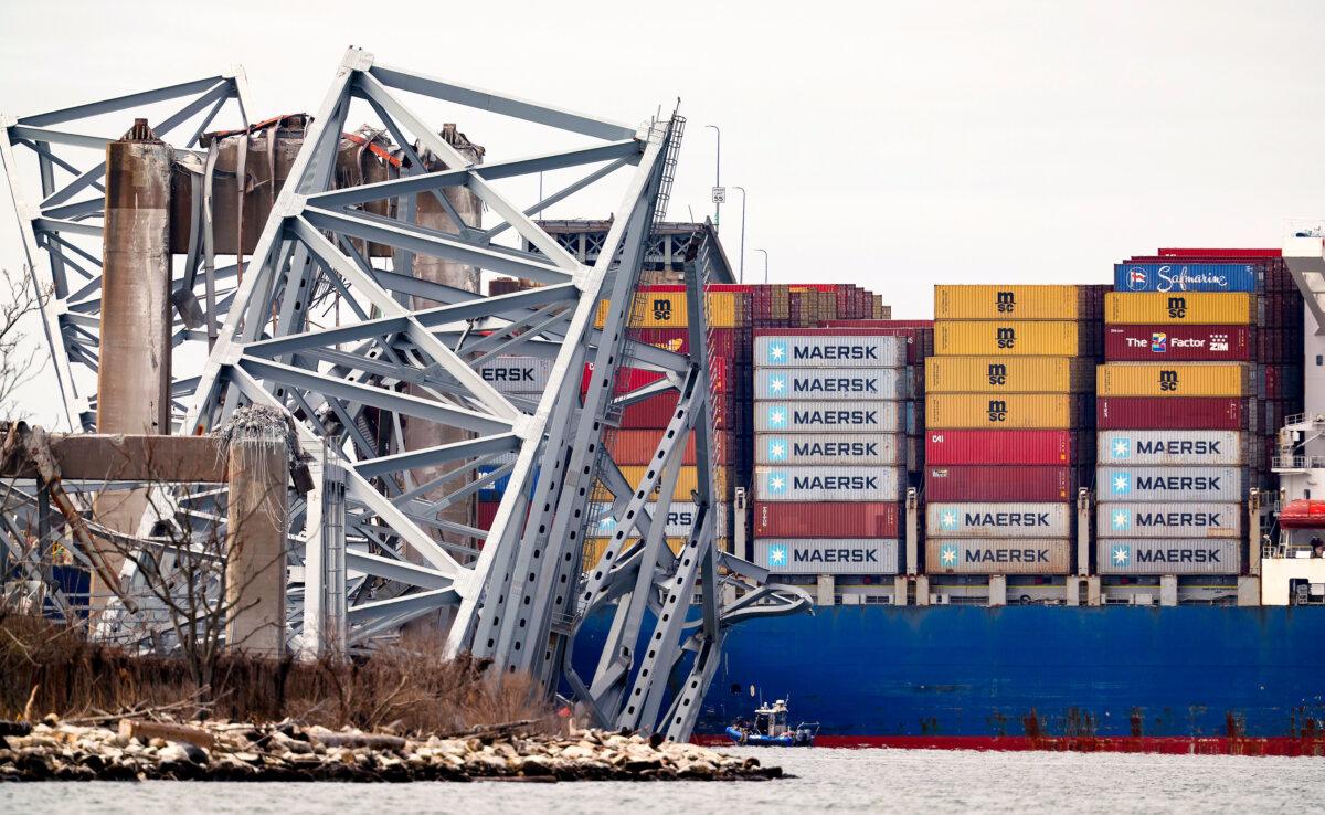 The cargo ship Dali sits in the water after running into and collapsing the Francis Scott Key Bridge in Baltimore on March 26, 2024. (Kevin Dietsch/Getty Images)