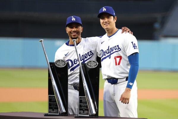 Mookie Betts (50) and Shohei Ohtani (17) of the Los Angeles Dodgers pose for a photo with trophies for being awarded the Silver Slugger award for the 2023 season prior to a game against the St. Louis Cardinals in Los Angeles on March 30, 2024. (Sean M. Haffey/Getty Images)