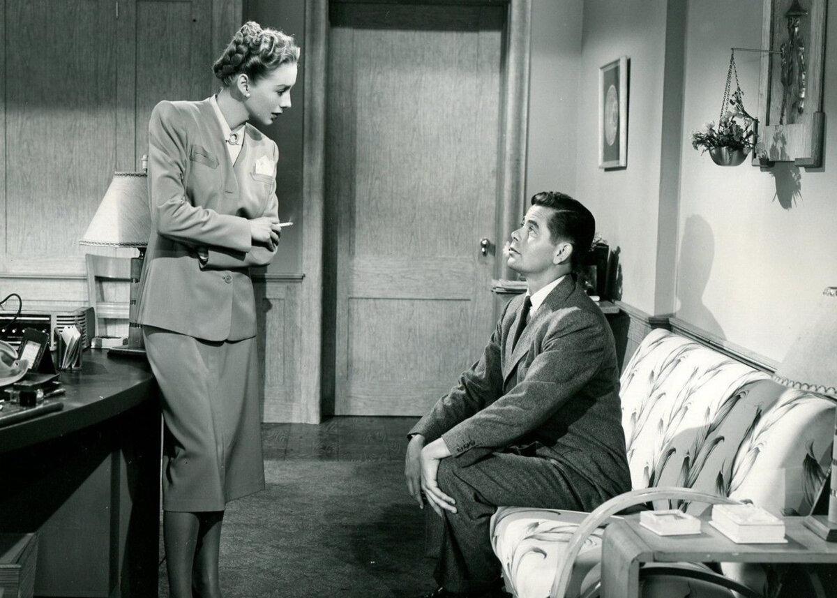 Doug Andrews (Glenn Ford) visits Millie McGonigle (Evelyn Keyes) at her office, in “The Mating of Millie.” (Columbia Pictures)