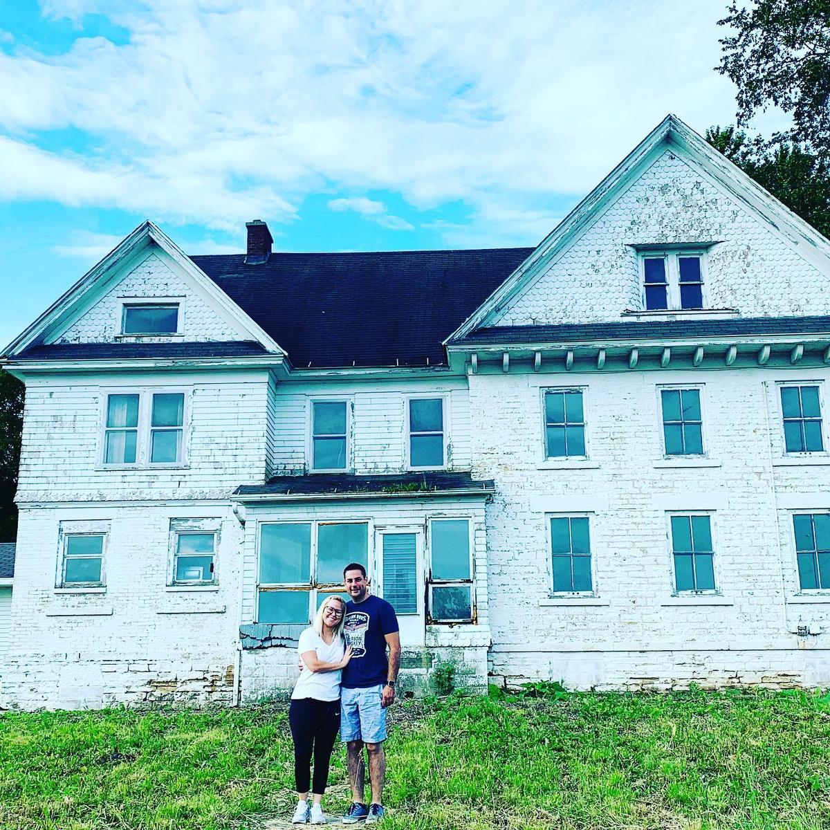 Mr. and Mrs. Grandchamp in front of the house before the transformation. (Courtesy of <a href="https://www.instagram.com/grandchampinteriors/">Megan Grandchamp</a>)