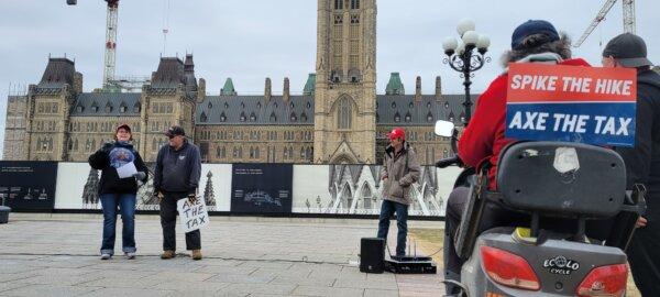 Demonstrators speak out against the carbon tax increase on Parliament Hill in Ottawa on April 1, 2024. (Matthew Horwood/The Epoch Times)