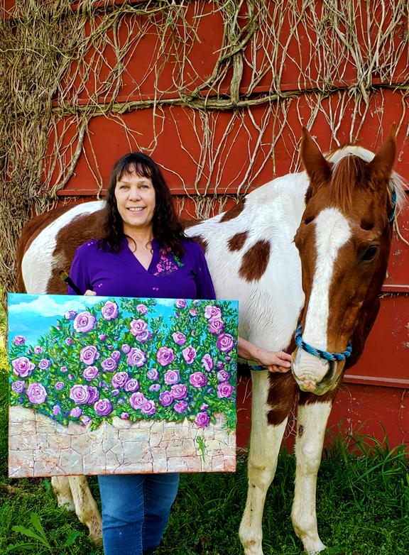 Pro-life advocate Juda Myers showcases her artwork alongside her horse Spot. (Courtesy of Richard Myers)