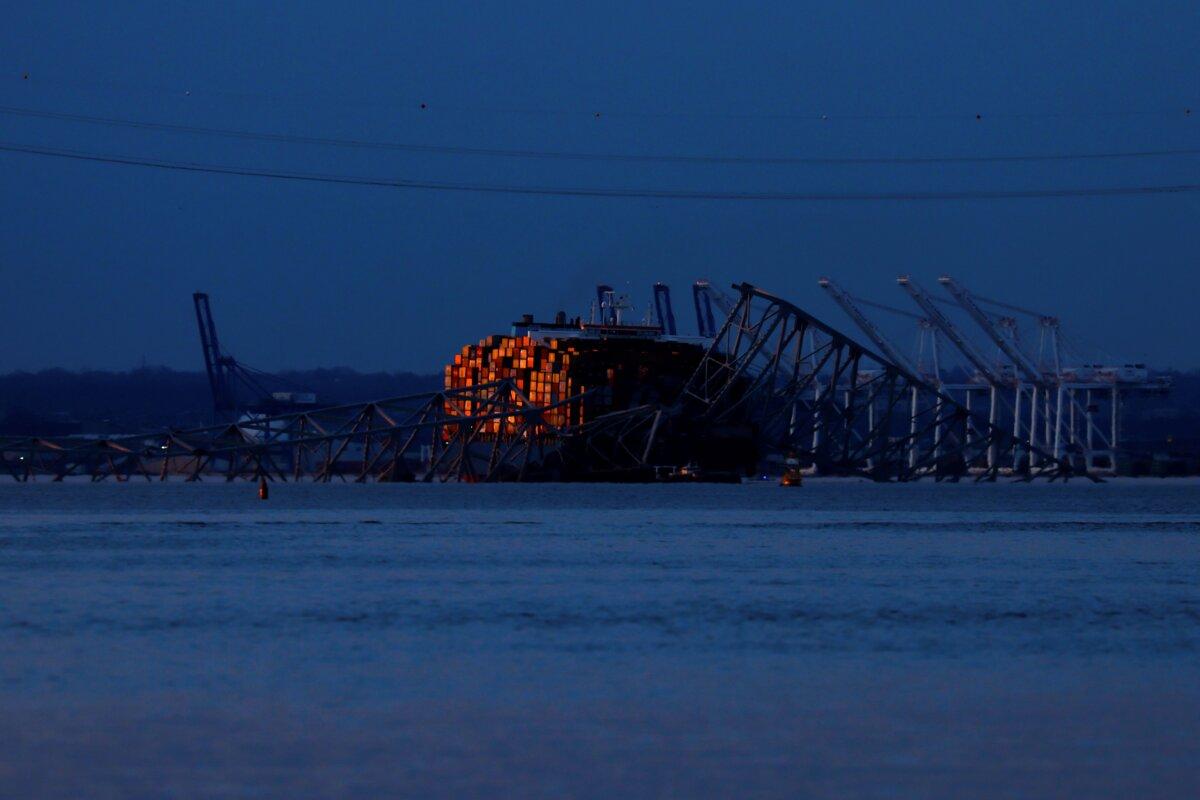 Wreckage of the Francis Scott Key Bridge rests on the container ship Dali in Baltimore on March 31, 2024. (Julia Nikhinson/AP Photo)