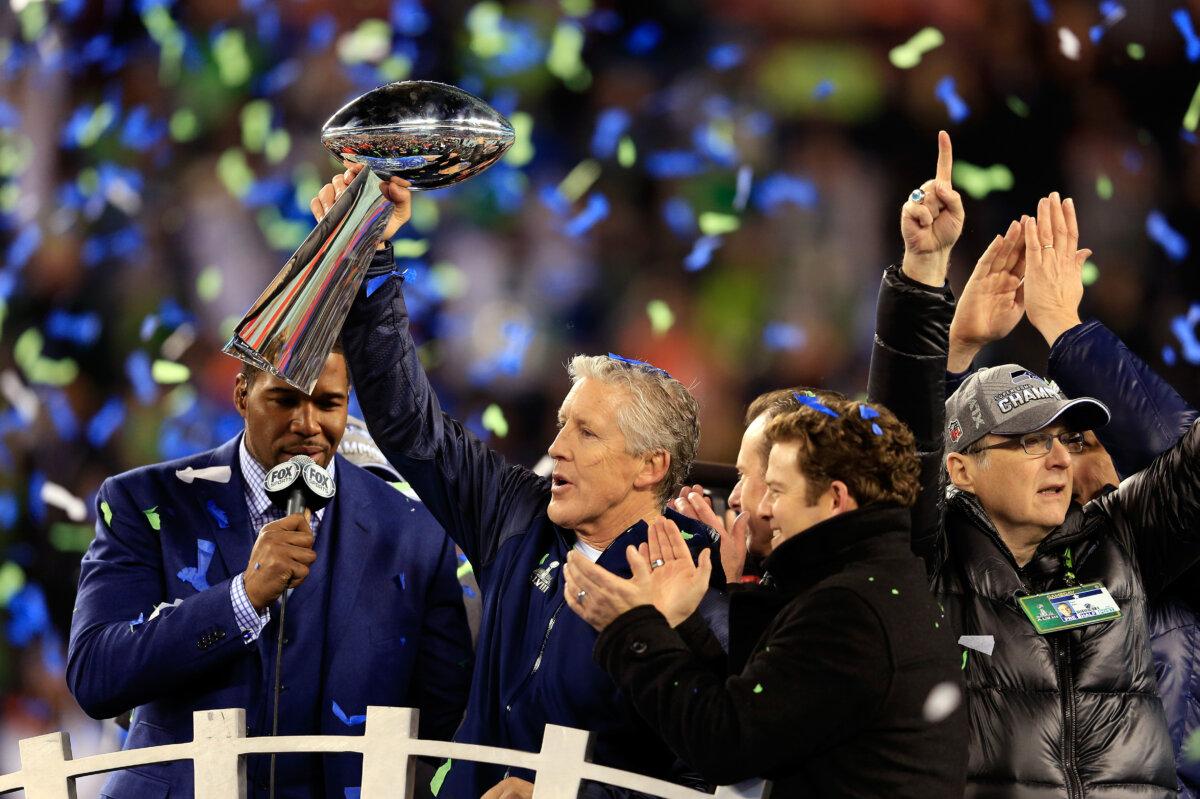 Head coach Pete Carroll of the Seattle Seahawks celebrates with the Vince Lombardi Trophy after their 43–8 victory over the Denver Broncos during Super Bowl XLVIII at MetLife Stadium in East Rutherford, New Jersey on February 2, 2014. (Rob Carr/Getty Images)