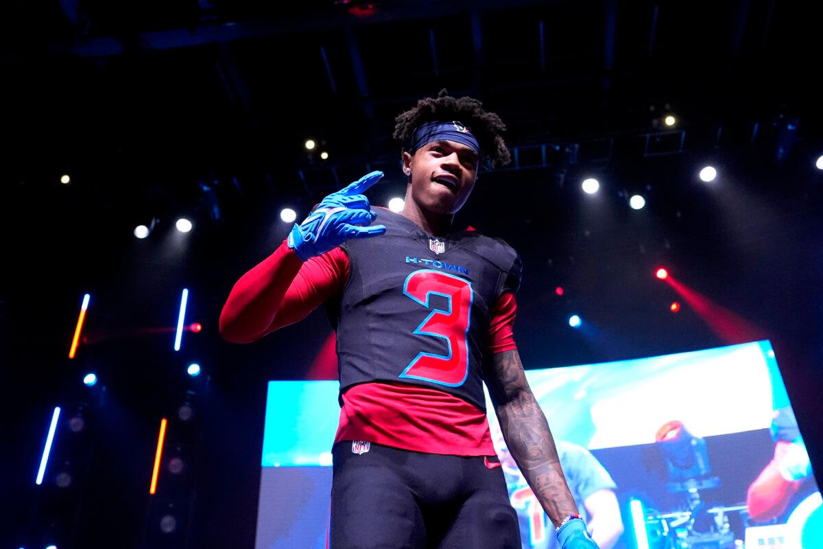 Houston Texans wide receiver Tank Dell wears a new uniform during an NFL football uniform release party, in Houston on April 23, 2024. (David J. Phillip/AP Photo)