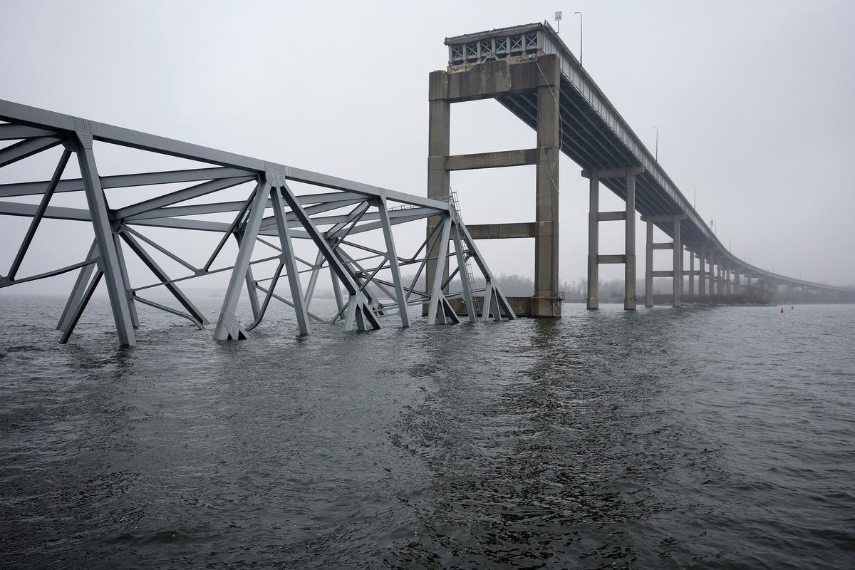 The wreckage of the Francis Scott Key Bridge sits partially submerged in the Patapsco River in Baltimore on April 2, 2024. (Chip Somodevilla/Getty Images)