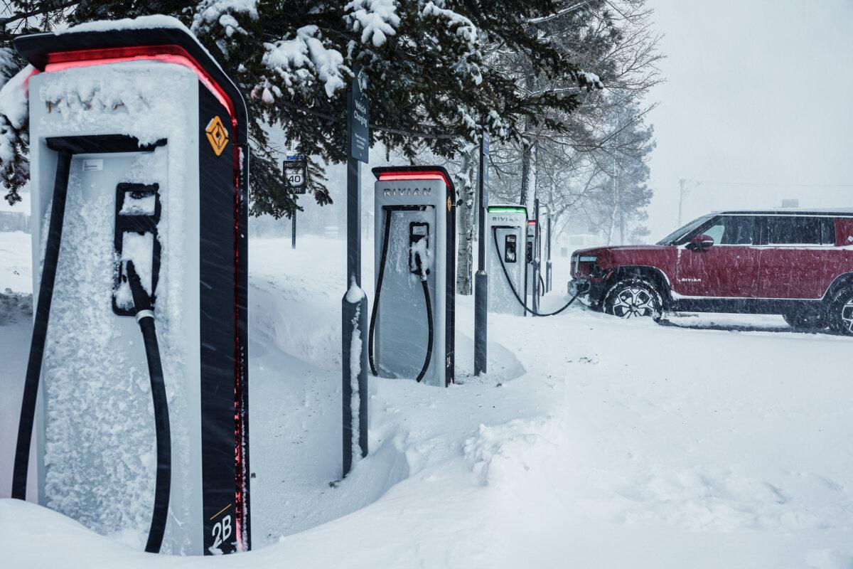 A Rivian truck recharges at a charging station during a snowstorm in Truckee, Calif., on March 3, 2024. (Mario Tama/Getty Images)
