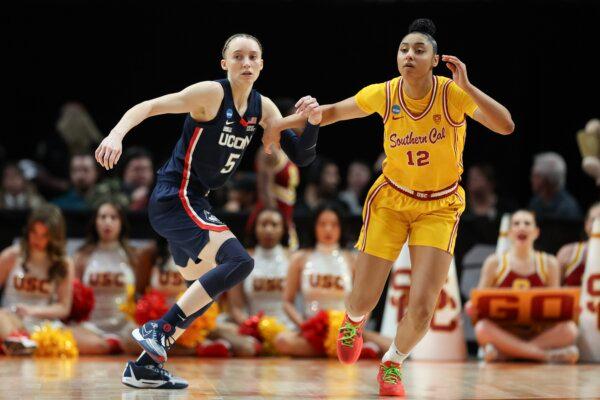 Paige Bueckers (5) of the Connecticut Huskies defends JuJu Watkins (12) of the USC Trojans during the second half in the Elite 8 round of the NCAA Women's Basketball Tournament in Portland on April 01, 2024. (Steph Chambers/Getty Images)