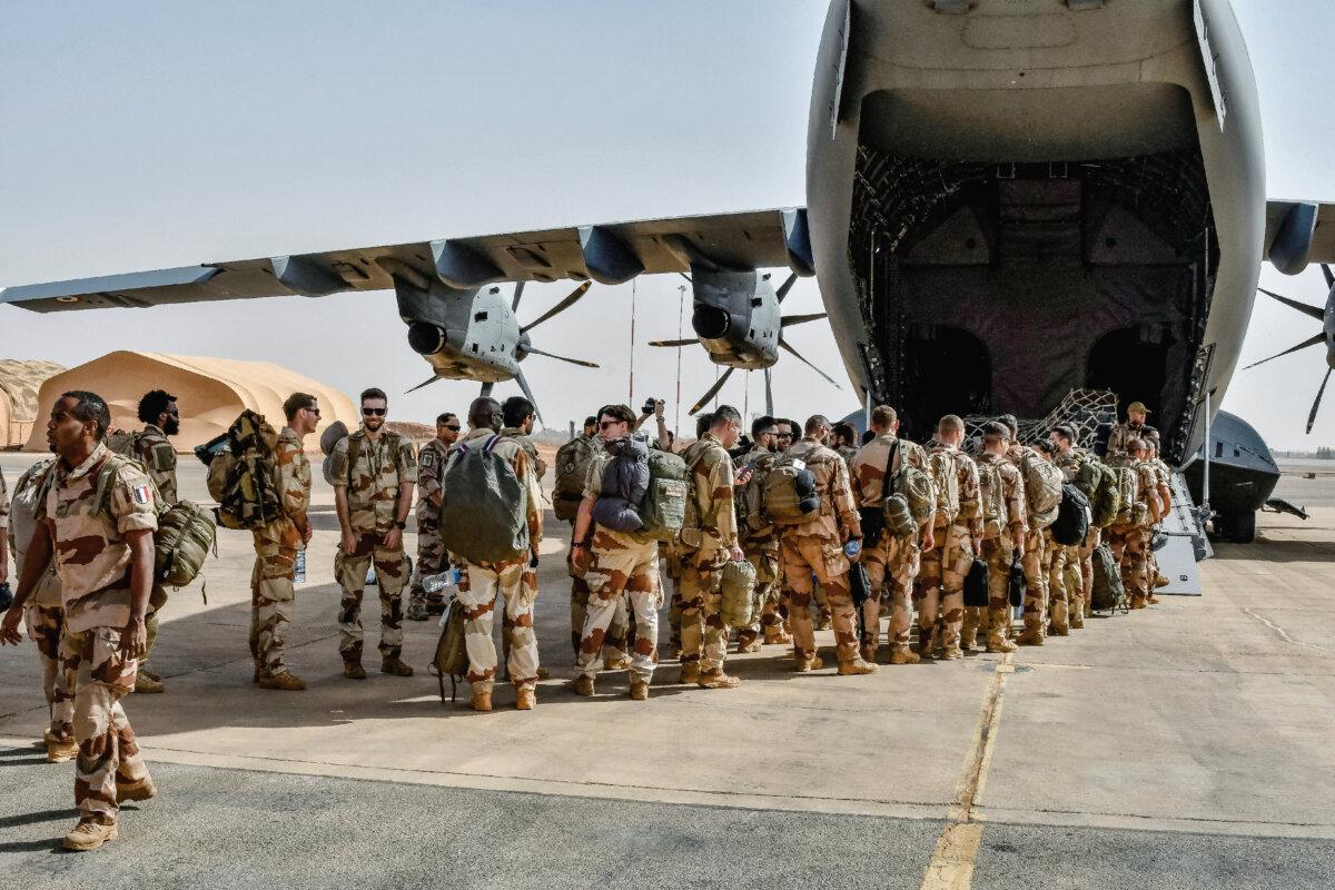 The last French soldiers board a military plane during their withdrawal from Niamey, Niger, on Dec. 22, 2023. (Boureima Hama/AFP via Getty Images)