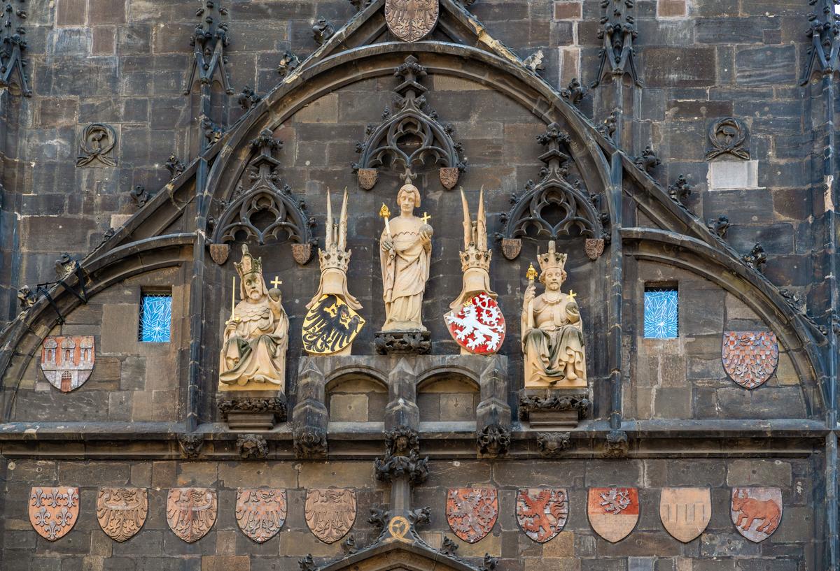 The Old Town Bridge Tower, featuring statues of King Charles IV, St. Vitus, and Wenceslas IV. (diegograndi/iStock/Getty Images Plus)