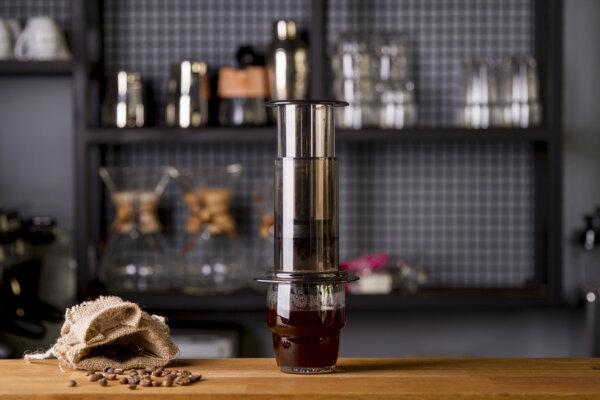The AeroPress is compact and easy to use, making it ideal for making coffee on the go. Just add hot water and then press down on the contraption. (Rabizo Anatolii, Nadir Keklik/Shutterstock)