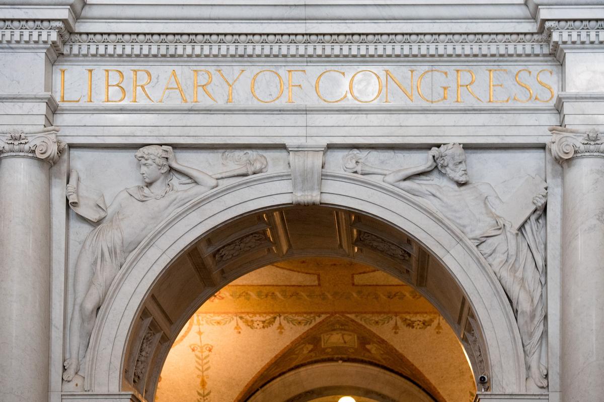 An ornate “Youth and Old Age Archway” leads to the main reading room of the Library of Congress Thomas Jefferson Building. On the archway’s left spandrel, a young man reads to seek knowledge, and on the right, an old man uses his wisdom to contemplate life. (Andrea Izzotti/Shutterstock)