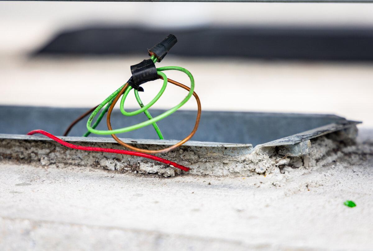 Wiring is stripped of its copper interior after an incident of theft in Los Angeles on April 4, 2024. (John Fredricks/The Epoch Times)