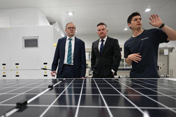 Australian Prime MInister Anthony Albanese (left) and Minister for Climate Change and Energy, Chris Bowen (centre) with founder and CEO Vince Allen (right) during a visit to Sundrive in Sydney, Australia on Nov. 1, 2023. Sundrive is Australia’s first mass production facility for solar panels. (AAP Image/Dean Lewins)