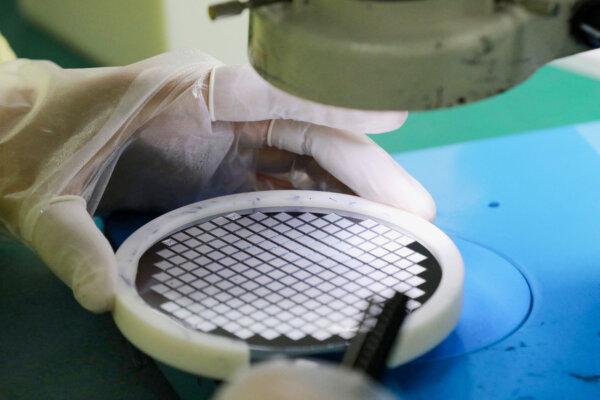 An employee makes a chip at a factory of Jiejie Semiconductor Company in Nantong, Jiangsu Province, China, on March 17, 2021. (AFP via Getty Images)