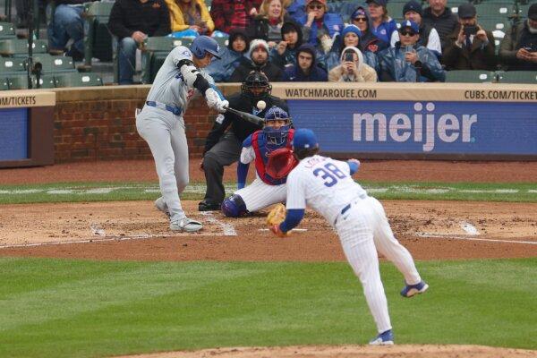 Shohei Ohtani (17) of the Los Angeles Dodgers hits a triple off Mark Leiter Jr. (38) of the Chicago Cubs during the sixth inning in Chicago on April 7, 2024. (Reaves/Getty Images)