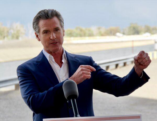 California Gov. Gavin Newsom speaks at a press conference at a pumping station on the Delta-Mendota Canal in Santa Nella, Calif., in the Central Valley on April 4, 2024. (Travis Gillmore/The Epoch Times)