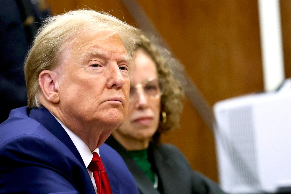 Former President Donald Trump sits with his lawyer Susan Necheles, in the courtroom at a hearing in his criminal case on charges stemming from hush money payments linked to extramarital affairs, n New York City, on March 25, 2024. (Brendan McDermid/Pool via Reuters)