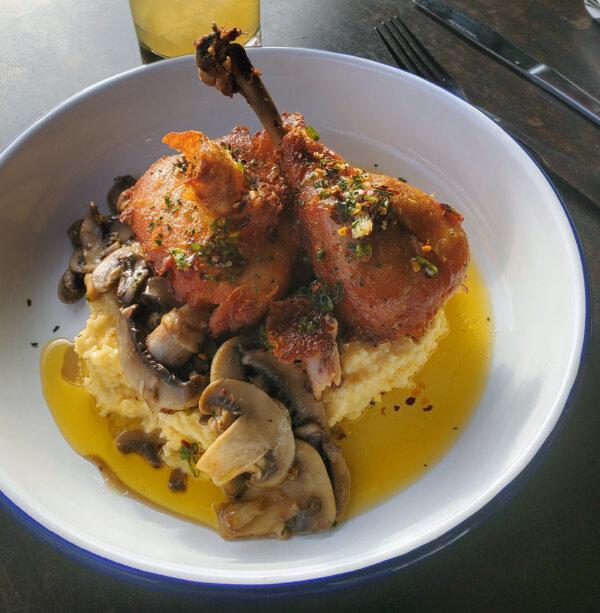 Confit Chicken Leg: Creamy grits, roasted wild mushrooms, chili oil, and herbs at The Stave Restaurant. (Rebecca Burnworth/TNS)