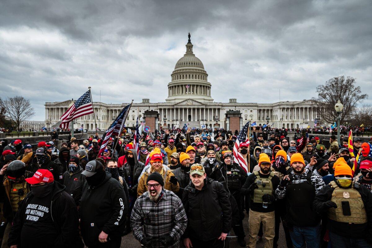 Pro-Trump protesters, including Proud Boys leader Joe Biggs (plaid shirt at the bottom center of the frame,) gather in front of the U.S. Capitol Building in Washington on Jan. 6, 2021. (Jon Cherry/Getty Images)