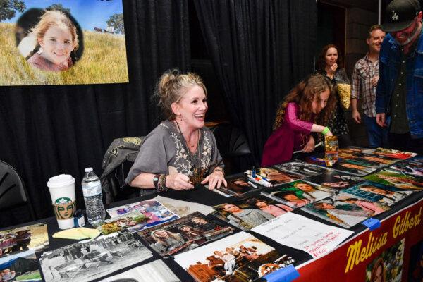 Actress Melissa Gilbert signs autographs for fans during the "Little House on the Prairie" 50th anniversary cast reunion and festival in Simi Valley, Calif., on March 23, 2024. (Valerie Macon/AFP via Getty Images)