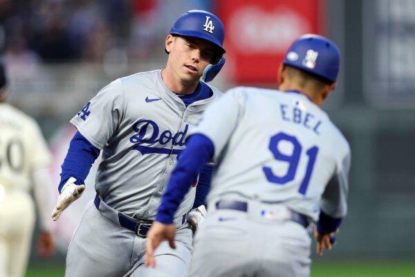 Will Smith (16) of the Los Angeles Dodgers celebrates his three-run home run as he rounds the bases against the Minnesota Twins in the fifth inning in Minneapolis on April 9, 2024. (David Berding/Getty Images)