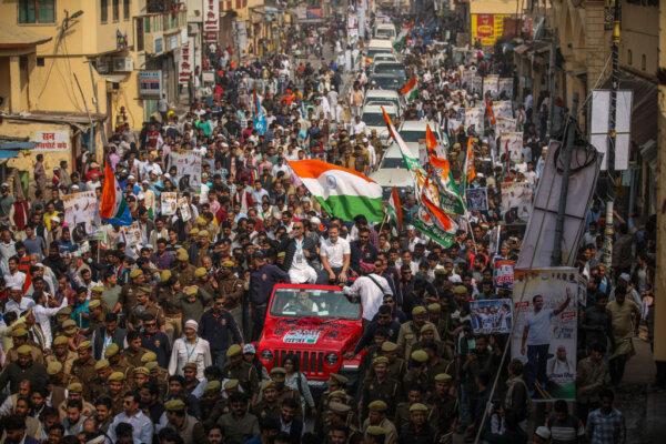 Indian National Congress Party leader Rahul Gandhi (sitting atop the Jeep, wearing white) takes part in a roadshow as part of his "Bharat Jodo Nyay Yatra" ("India Come Together Anew") tour, on Feb. 17, 2024 in Varanasi, India. (Ritesh Shukla/Getty Images)