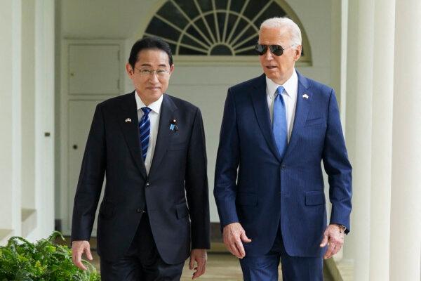 U.S. President Joe Biden and Japanese Prime Minister Fumio Kishida walk along the colonnade to the Oval Office of the White House in Washington, on April 10, 2024. (Kevin Lamarque /POOL/AFP via Getty Images)