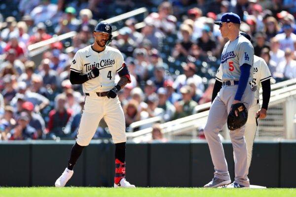 Carlos Correa (4) of the Minnesota Twins celebrates his single against the Los Angeles Dodgers in the third inning in Minneapolis on April 10, 2024. (David Berding/Getty Images)