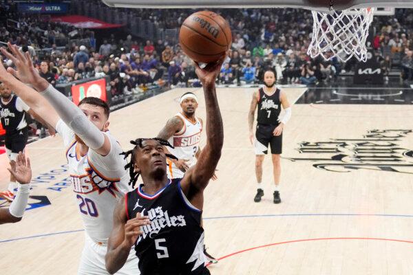 Clippers guard Bones Hyland shoots against the Suns in Los Angeles on April 10, 2024. (Mark J. Terrill/AP Photo)