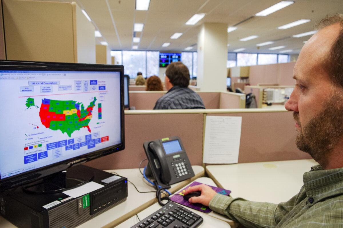 26 States File Lawsuits in Federal Courts Over ATF Redefinition of Gun Dealers 2 A researcher simulates a check done for the National Instant Criminal Background Check System at the FBI’s criminal justice center in Bridgeport, W.Va., on Nov. 18, 2014. (Matt Stroud/AP Photo)