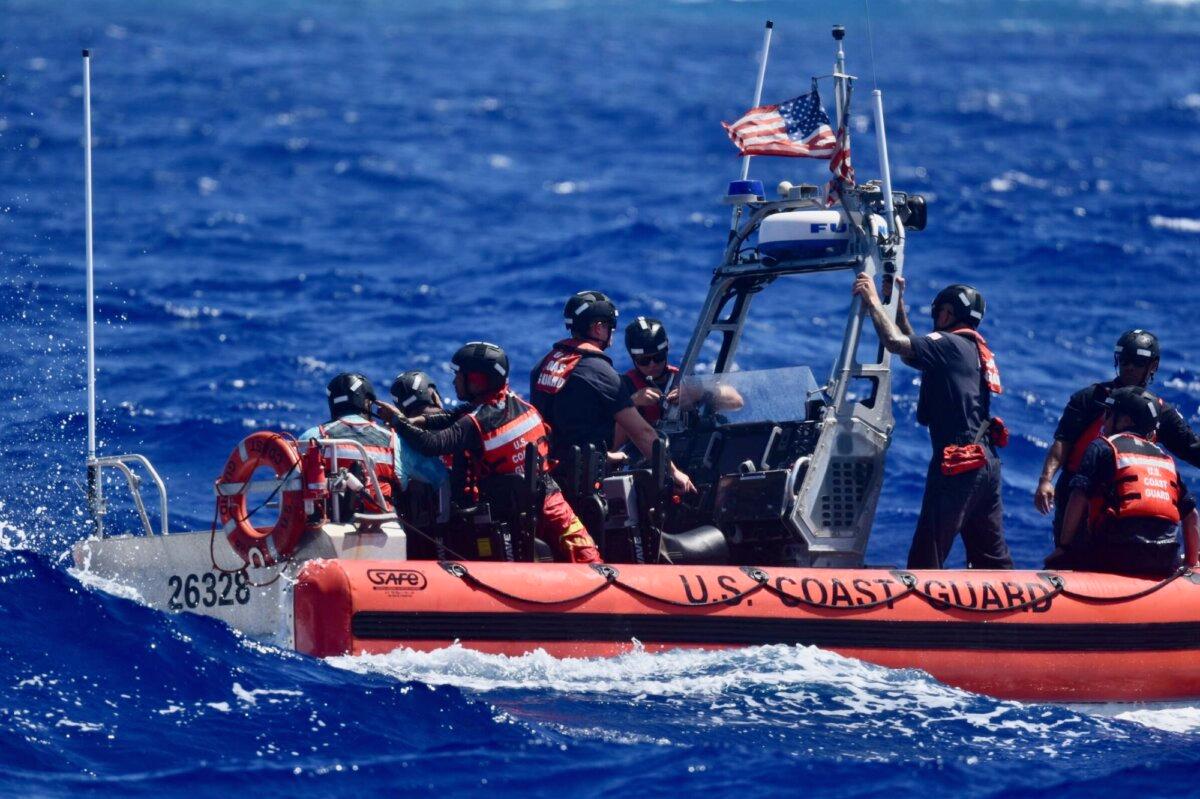 The crew of USCGC Oliver Henry after rescuing three mariners stranded on Pikelot Atoll, Yap State, Federated States of Micronesia, on April 9, 2024. (Courtesy of U.S. Coast Guard)
