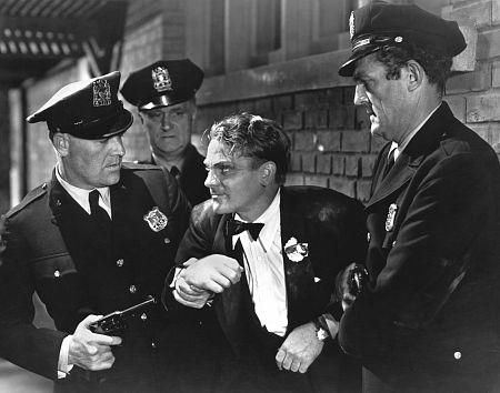 James Cagney (C) plays a gangster who finally gets his due, in “The Public Enemy." (Warner Bros.)