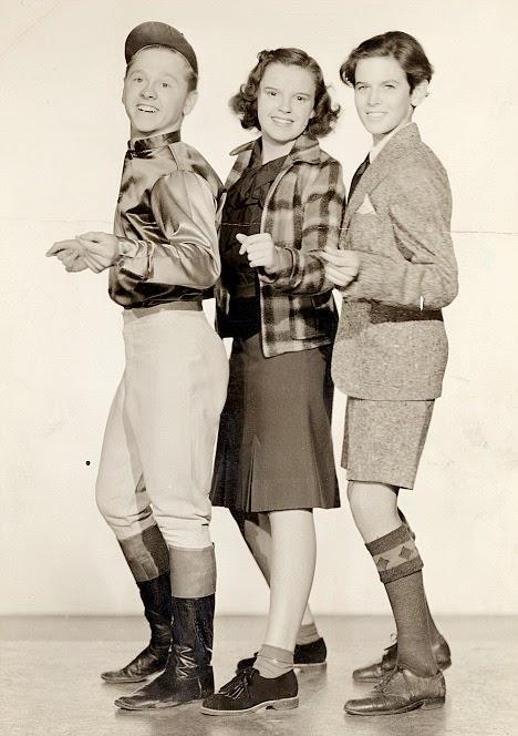 (L–R) Timmie Donovan (Mickey Rooney), Cricket West (Judy Garland), and Roger Calverton (Ronald Sinclair), in “Thoroughbreds Don’t Cry.” (Metro-Goldwyn-Mayer)
