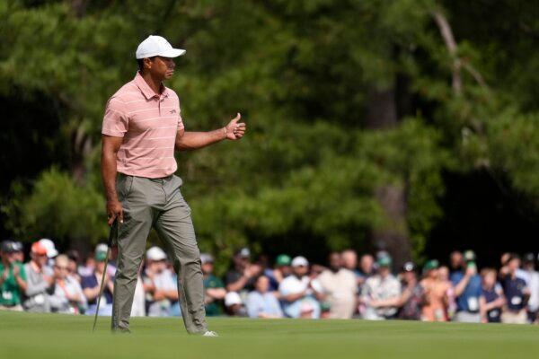 Tiger Woods celebrates after a birdie on the first hole during the Masters golf tournament in Augusta, Ga., on April 11, 2024. (Ashley Landis/AP Photo)