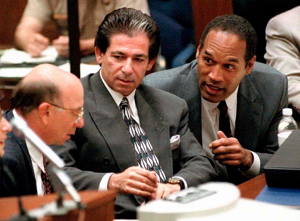 This 3 May 1995 file photo shows murder defendant O.J. Simpson (R) consulting with  Robert Kardashian (C) and Alvin Michelson (L) during a hearing in Los Angeles. (Vince Bucci/ AFP via Getty Images)