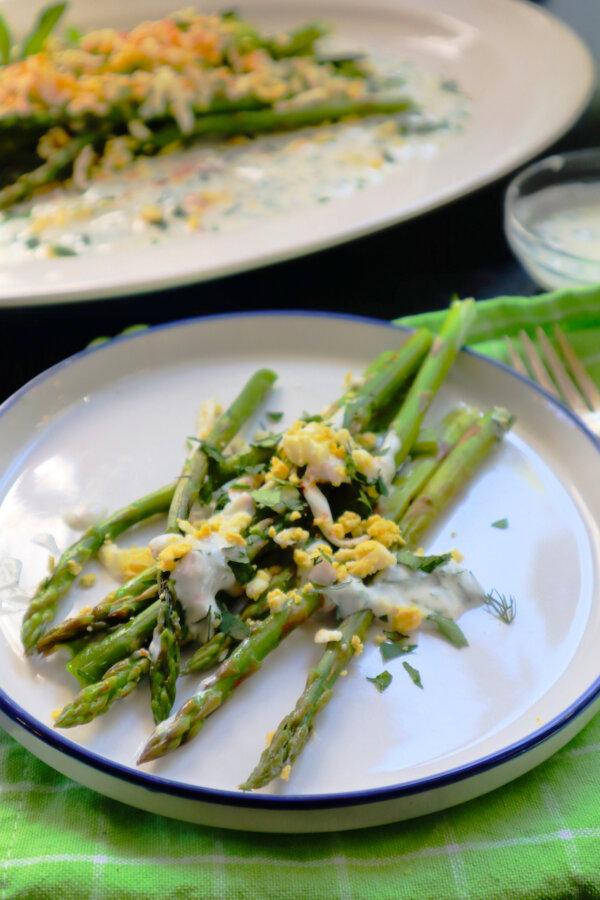 A simple asparagus salad with grated egg and yogurt sauce is an elegant side dish. (Gretchen McKay/Pittsburgh Post-Gazette/TNS)