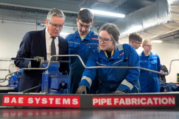 Labour Party leader Sir Keir Starmer being shown tools during a campaign visit to BAE Systems in Barrow-in-Furness, Cumbria, on April 12, 2024. (Danny Lawson/PA Wire)