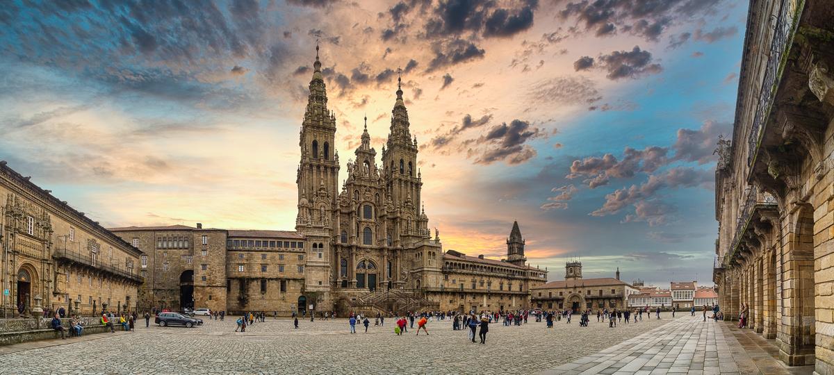 Pilgrims gather in Plaza del Obradoiro, in front of the Cathedral of Santiago de Compostela in Galicia, Spain. The cathedral is considered to be the burial site of St. James the Apostle. (francisco crusat/iStock/Getty Images)