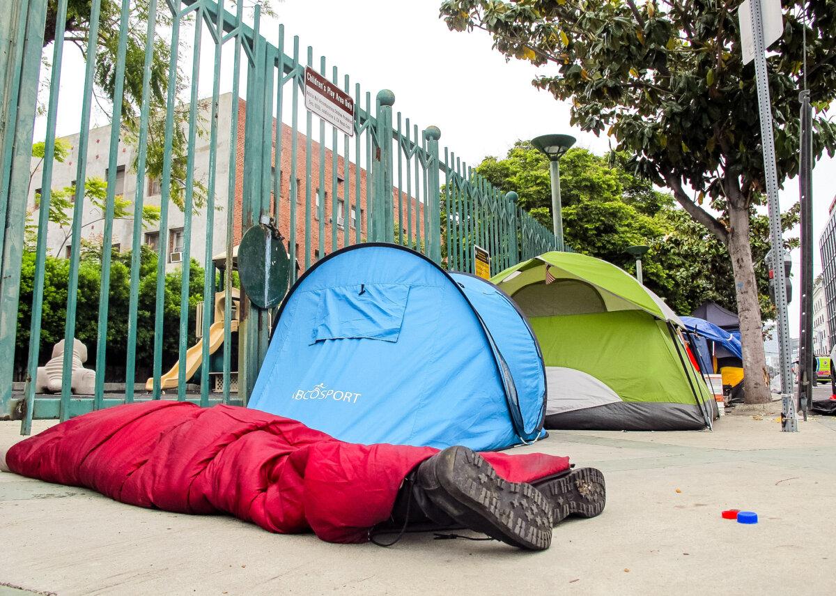 A homeless encampment next to a park playground on Selma Avenue in Los Angeles. (Courtesy of Keith Johnson)