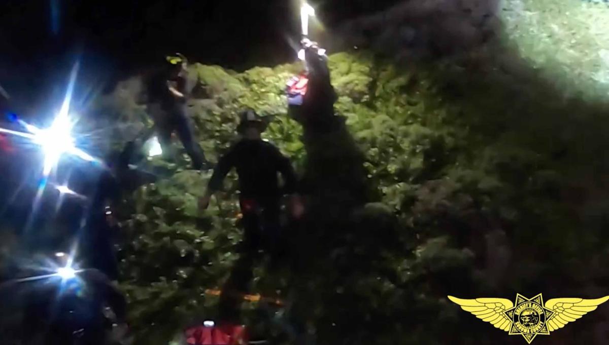 Southern Marin firefighters welcome the pair back to solid ground immediately following the rescue. (Courtesy of Sonoma County Sheriff's Department)