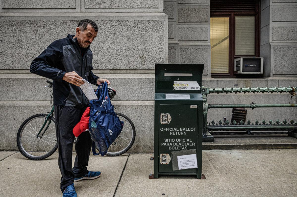 A voter casts his ballot at a drop box outside Philadelphia City Hall on Oct. 24, 2022. (Ed Jones/AFP via Getty Images)