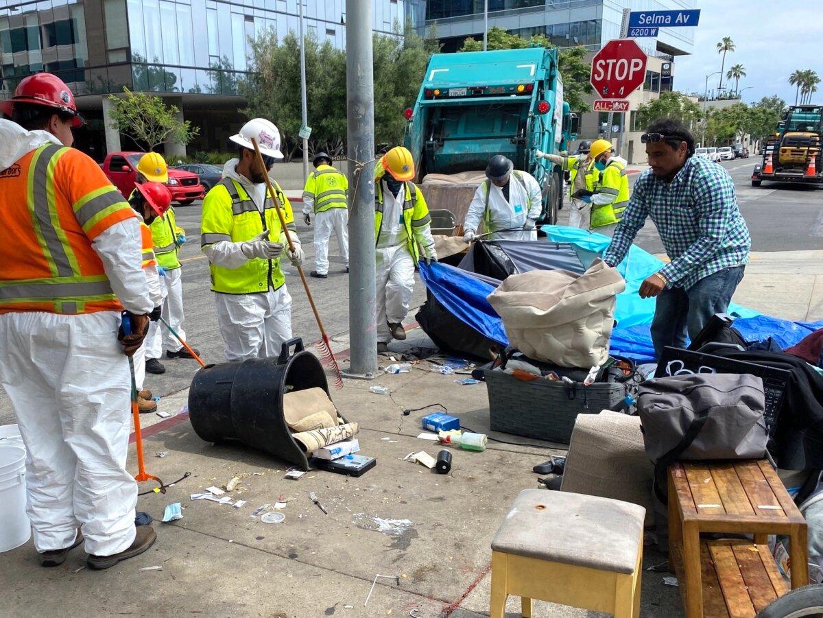 Inside Safe crews clean up a homeless encampment on El Centro Avenue. (Courtesy of Keith Johnson)