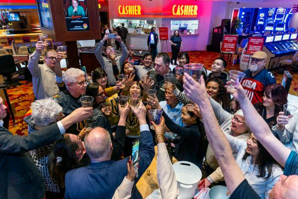 Table games shut down, the staff and others gather for a champagne toast during the final night of gaming at the Tropicana on Tuesday, April 2, 2024, in Las Vegas. (L.E. Baskow/Las Vegas Review-Journal/TNS) @Left_Eye_Images