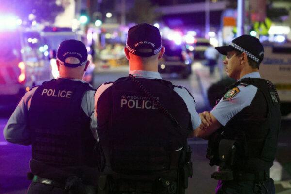 Police keep watch in front of the Westfield Bondi Junction shopping mall after a stabbing incident in Sydney on April 13, 2024. (DAVID GRAY/AFP via Getty Images)