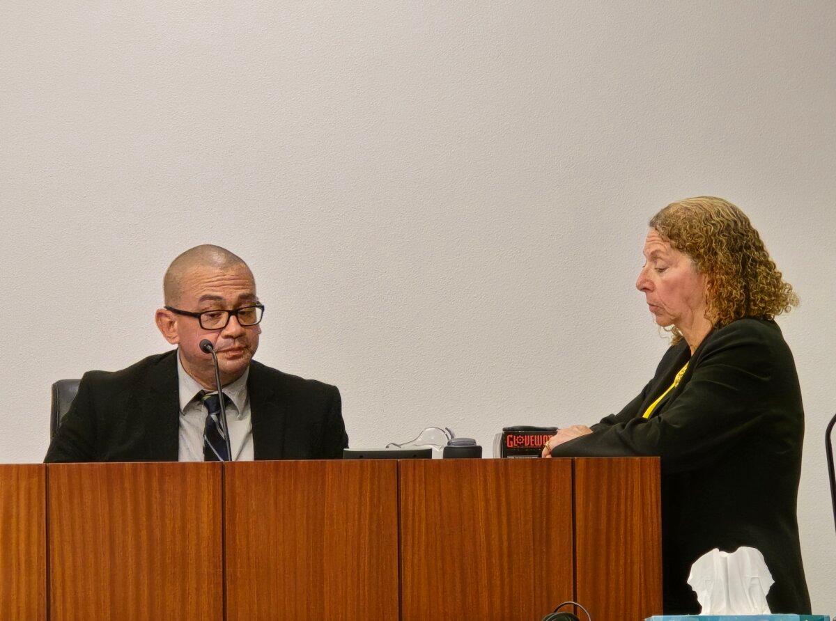 Jorge Ainza, a detective in the Santa Cruz County Sheriff's Office Criminal Investigations Division (L) gives testimony under questioning by defense attorney Kathy Lowthorp (R) in Superior Court in Nogales, Ariz., on April 12, 2024. (Allan Stein/The Epoch Times)