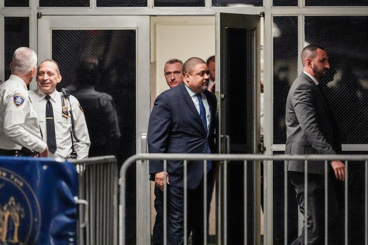 Manhattan district attorney Alvin Bragg (C) returns to court for a pre-trial hearing in a hush-money case for former President Donald Trump in criminal court in New York City on March 25, 2024. (Mary Altaffer-Pool/Getty Images)