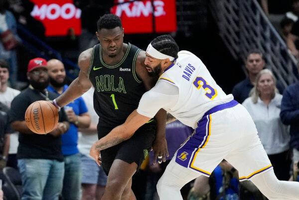 Lakers forward Anthony Davis defends against Pelicans standout Zion Williamson in New Orleans on April 14, 2024. (Gerald Herbert/AP Photo)