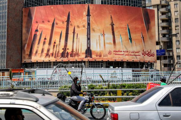 A billboard depicting Iranian ballistic missiles is seen in Valiasr Square in central Tehran, Iran, on April 15, 2024. (Atta Kenare/AFP via Getty Images)