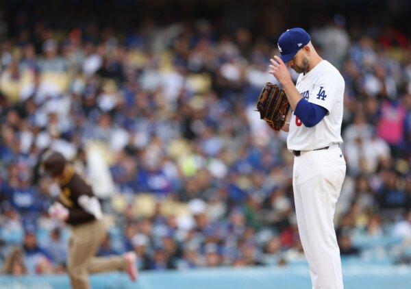 James Paxton (65) of the Los Angeles Dodgers reacts to a solo homerun from Manny Machado (13) of the San Diego Padres during the fourth inning in Los Angeles on April 14, 2024. (Harry How/Getty Images)